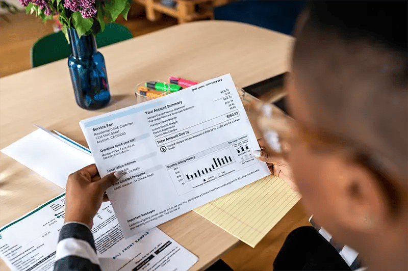 Person looking at a paper bill
